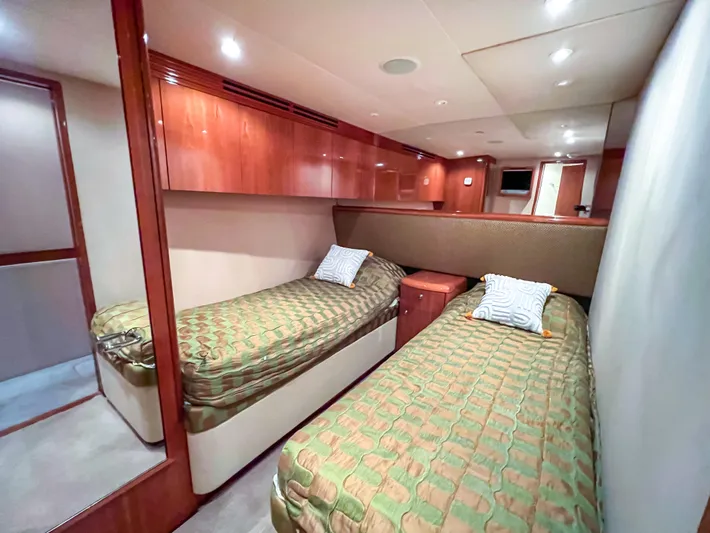  Yacht Photos Pics Luxurious twin cabin interior of 2007 Hatteras 68 Convertible yacht.