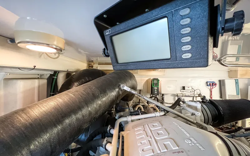  Yacht Photos Pics Engine room of 2007 Hatteras 68 Convertible yacht with control panel and machinery.