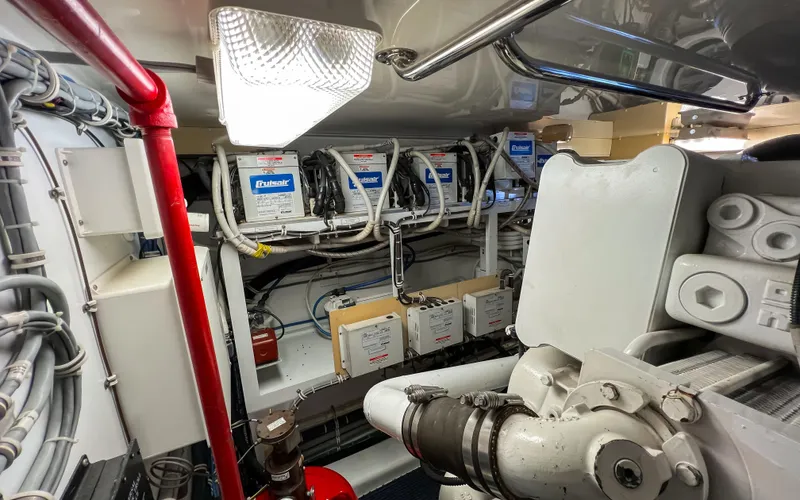  Yacht Photos Pics Engine room of 2007 Hatteras 68 Convertible yacht, showcasing mechanical components and wiring.