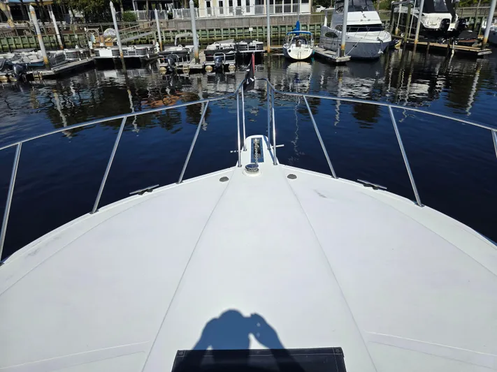  Yacht Photos Pics Bow view of 1997 Navigator 5000 Classic yacht docked at marina.