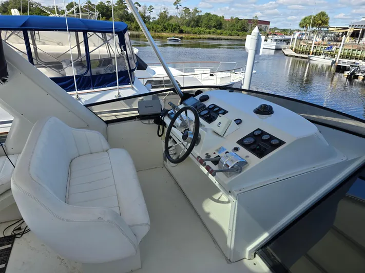  Yacht Photos Pics Cockpit of 1997 Navigator 5000 Classic yacht with steering wheel and control panel.