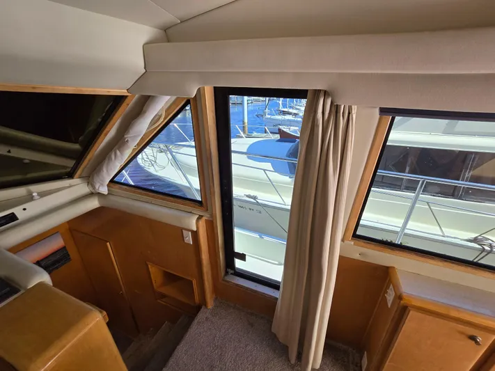  Yacht Photos Pics Interior view of a 1997 Navigator 5000 Classic yacht with marina backdrop.