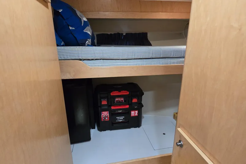  Yacht Photos Pics 1997 Navigator 5000 Classic storage area with shelves and toolboxes.