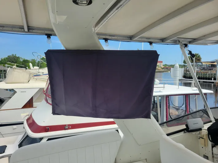  Yacht Photos Pics Navigator 5000 Classic 1997 yacht interior with covered equipment, docked at marina.