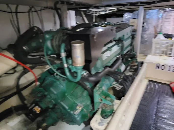  Yacht Photos Pics Engine room of a 1997 Navigator 5000 Classic yacht, featuring a green marine engine.