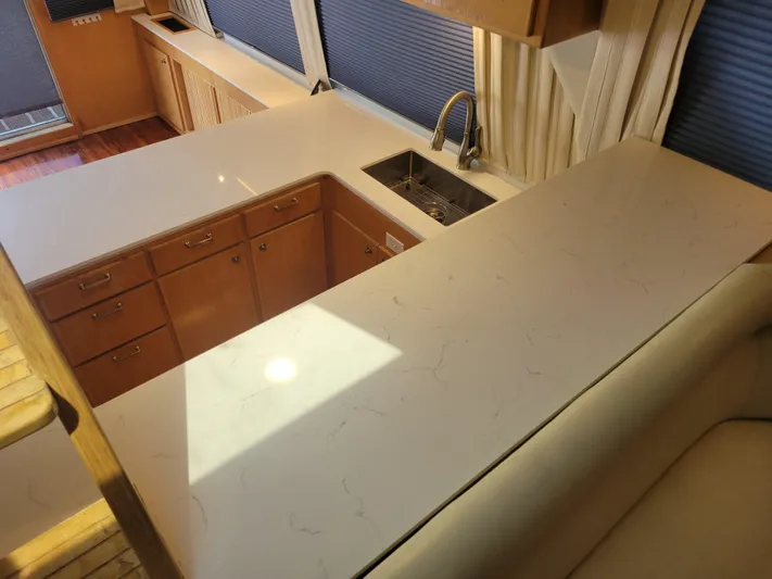  Yacht Photos Pics Spacious kitchen area in a 1997 Navigator 5000 Classic with modern countertops and sink.