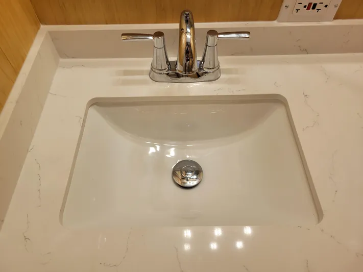  Yacht Photos Pics Modern bathroom sink with chrome faucet on marble countertop.