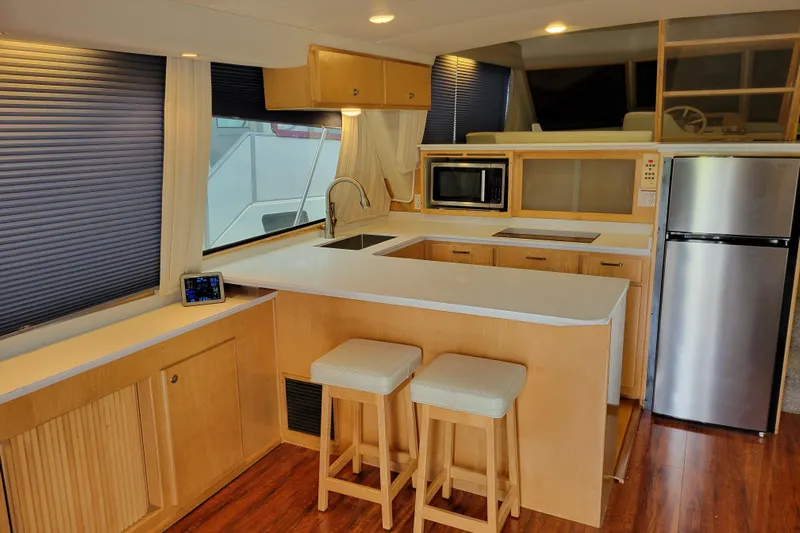  Yacht Photos Pics Modern kitchen interior on a 1997 Navigator 5000 Classic yacht with wood accents.