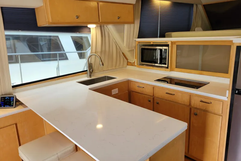  Yacht Photos Pics Luxurious kitchen interior of 1997 Navigator 5000 Classic yacht with modern appliances.