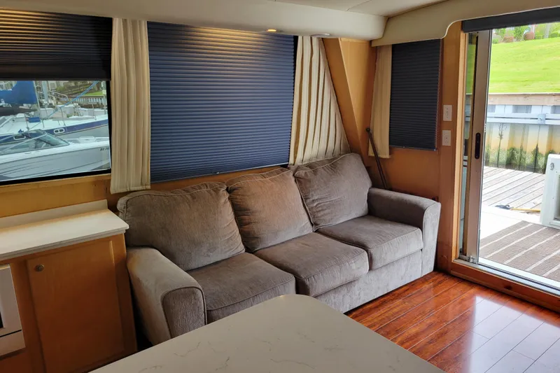  Yacht Photos Pics Interior of 1997 Navigator 5000 Classic yacht with sofa and sliding door.