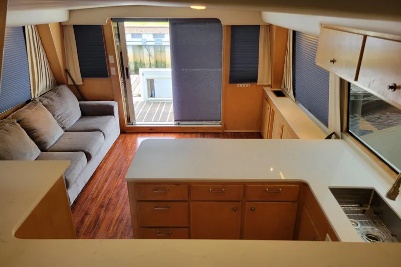  Yacht Photos Pics Interior of 1997 Navigator 5000 Classic yacht with modern kitchen and cozy seating area.