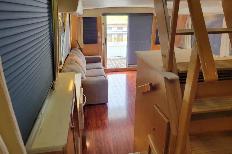  Yacht Photos Pics Interior of 1997 Navigator 5000 Classic yacht with wooden floors and cozy seating area.