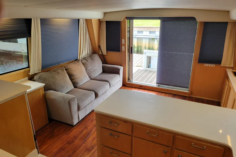  Yacht Photos Pics Interior of 1997 Navigator 5000 Classic yacht with sofa and sliding door.