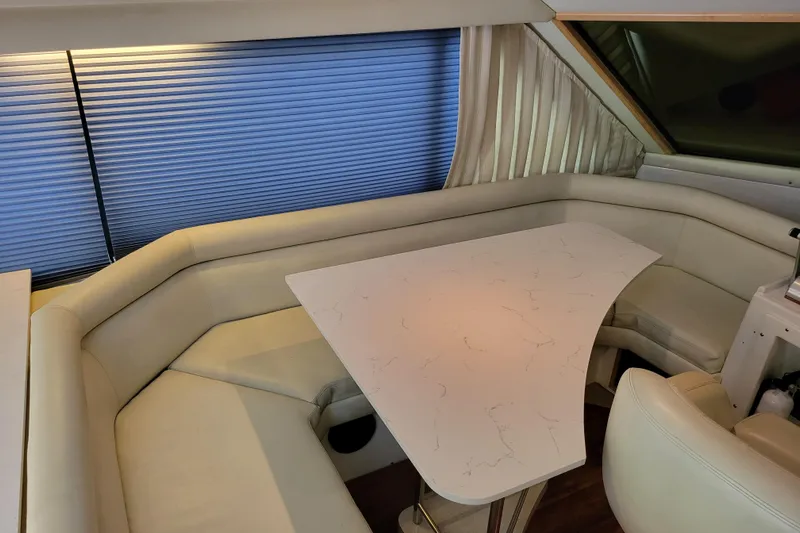  Yacht Photos Pics Luxurious interior of 1997 Navigator 5000 Classic yacht with elegant seating and table.