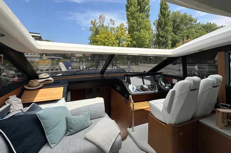  Yacht Photos Pics Luxurious 2017 Princess S60 yacht interior with plush seating and modern helm.