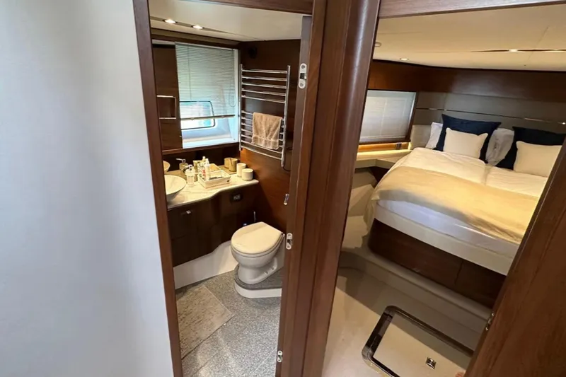  Yacht Photos Pics Luxurious interior of 2017 Princess S60 yacht featuring bedroom and bathroom.