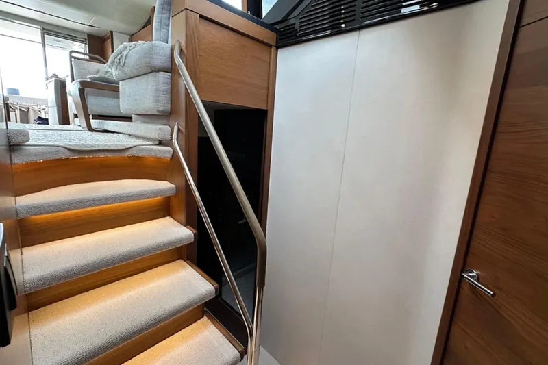  Yacht Photos Pics Interior of 2017 Princess S60 yacht with carpeted stairs and modern design.