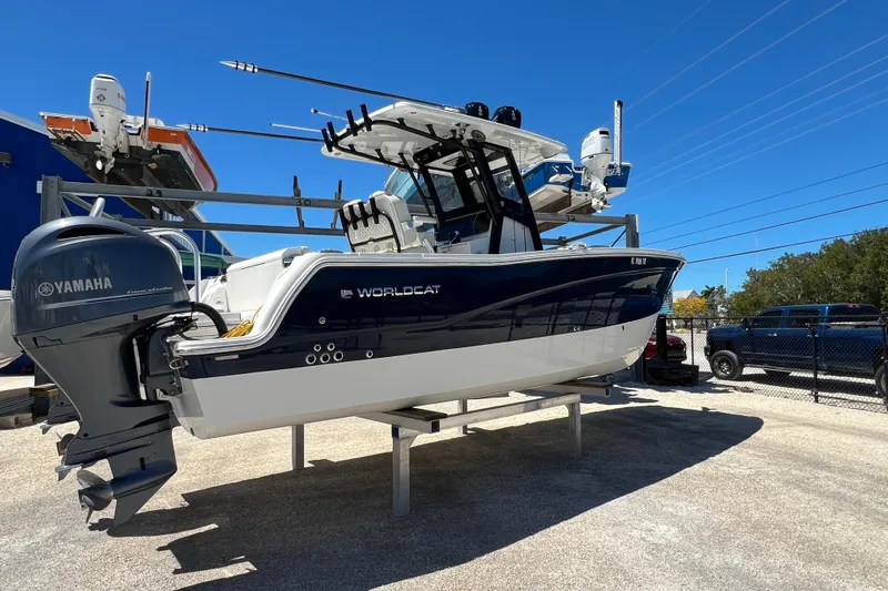  Yacht Photos Pics 2024 World Cat 260 CC-X boat with Yamaha engine on display under clear blue sky.