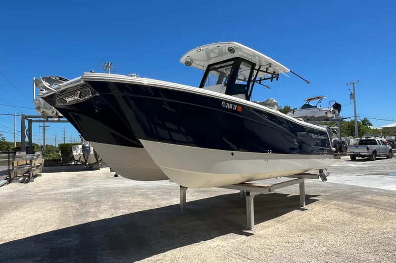  Yacht Photos Pics 2024 World Cat 260 CC-X boat on display under clear blue sky.