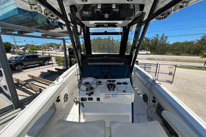  Yacht Photos Pics 2024 World Cat 260 CC-X boat interior with steering wheel and control panel.