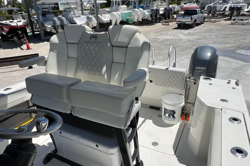  Yacht Photos Pics 2024 World Cat 260 CC-X boat interior with dual seats and steering wheel.