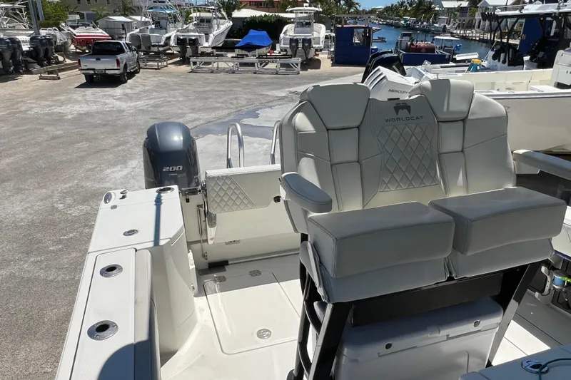  Yacht Photos Pics 2024 World Cat 260 CC-X boat interior with seating and engine view.