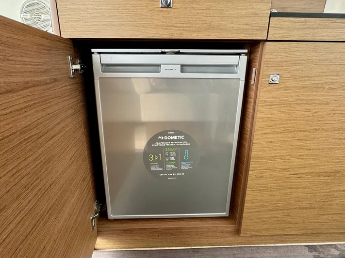 September II Yacht Photos Pics Built-in Dometic refrigerator in 2018 Jeanneau NC 11 boat kitchen.