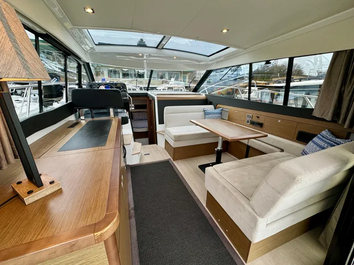 September II Yacht Photos Pics Interior of 2018 Jeanneau NC 11 yacht with modern seating and dining area.