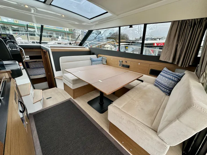 September II Yacht Photos Pics Interior of 2018 Jeanneau NC 11 yacht with spacious seating and dining area.