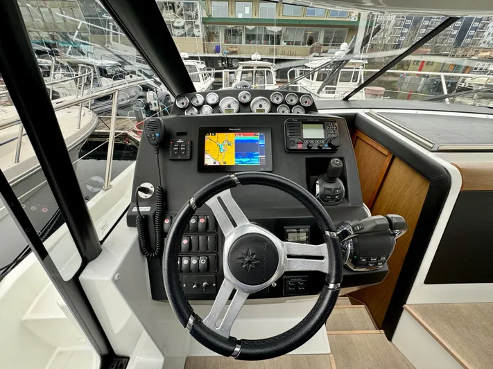 September II Yacht Photos Pics 2018 Jeanneau NC 11 boat helm with navigation system and controls.