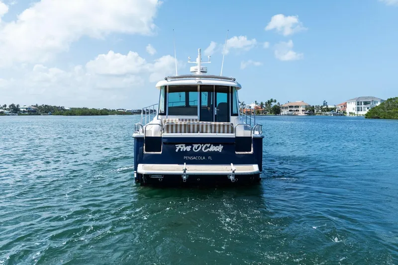 Five O'clock Yacht Photos Pics 2013 Sabre 38 Salon Express yacht cruising in Pensacola waters under a clear sky.