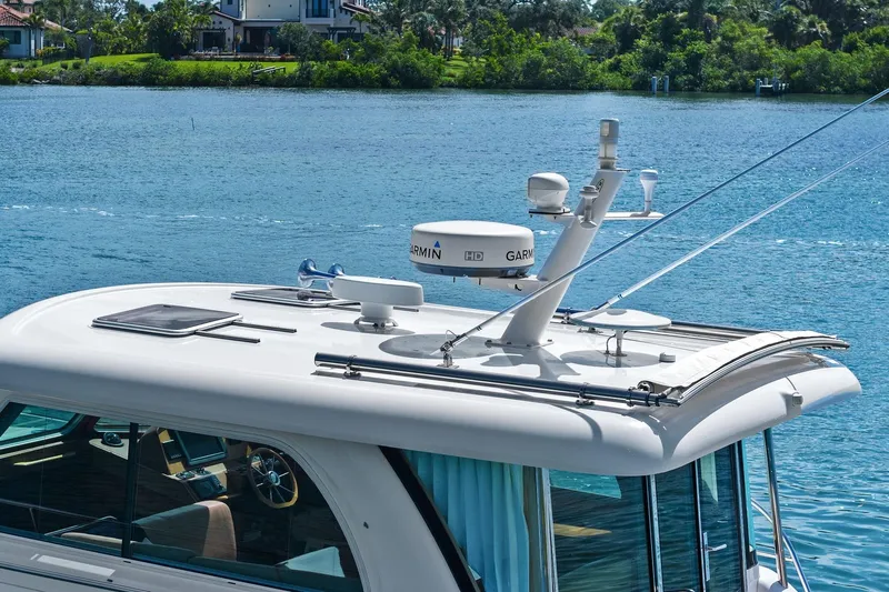 Five O'clock Yacht Photos Pics 2013 Sabre 38 Salon Express yacht with Garmin radar on calm water.