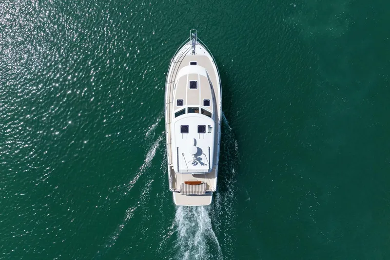 Five O'clock Yacht Photos Pics Aerial view of 2013 Sabre 38 Salon Express yacht cruising on open water.