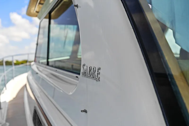 Five O'clock Yacht Photos Pics 2013 Sabre 38 Salon Express yacht, side view with logo detail.