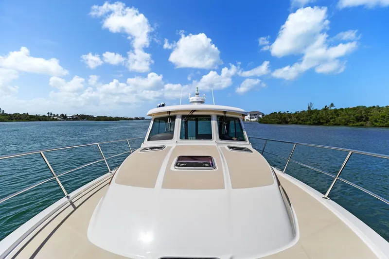 Five O'clock Yacht Photos Pics 2013 Sabre 38 Salon Express yacht cruising on a sunny day with blue skies.