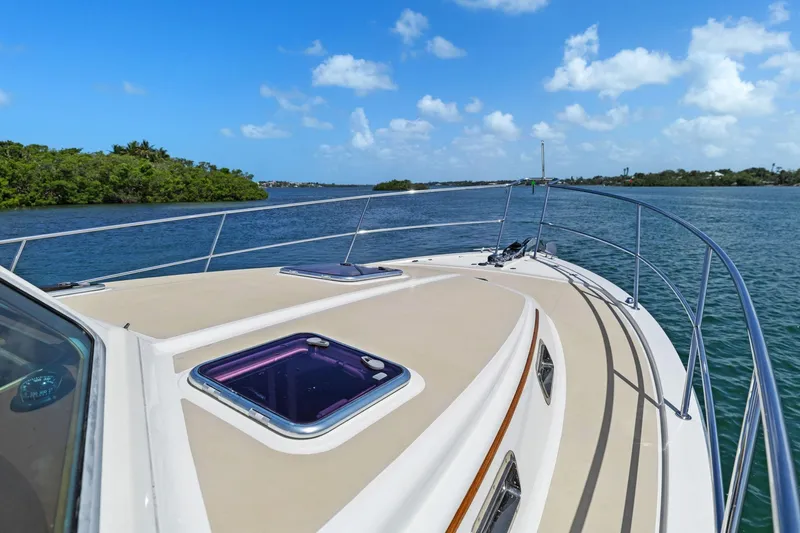 Five O'clock Yacht Photos Pics 2013 Sabre 38 Salon Express yacht cruising on a sunny day with clear blue skies.