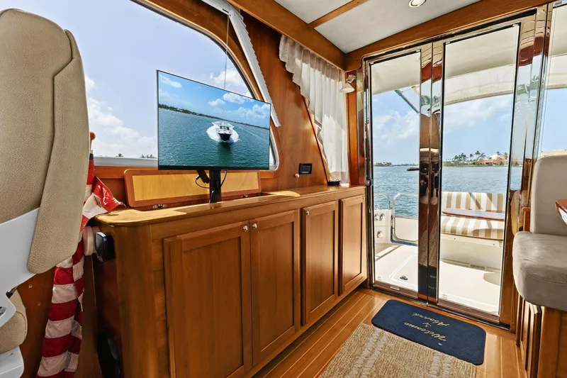 Five O'clock Yacht Photos Pics Interior of 2013 Sabre 38 Salon Express yacht with wooden cabinetry and ocean view.
