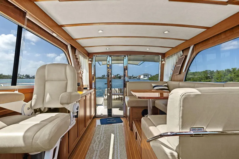 Five O'clock Yacht Photos Pics Interior of 2013 Sabre 38 Salon Express yacht with elegant seating and scenic views.