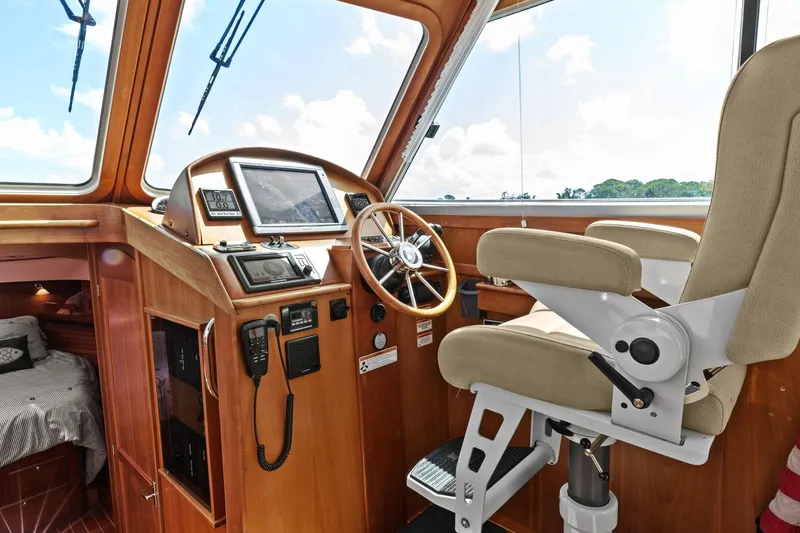 Five O'clock Yacht Photos Pics 2013 Sabre 38 Salon Express helm with navigation equipment and captain's chair.