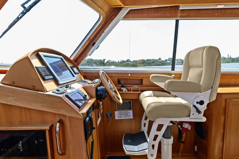 Five O'clock Yacht Photos Pics 2013 Sabre 38 Salon Express helm with navigation screens and captain's chair.