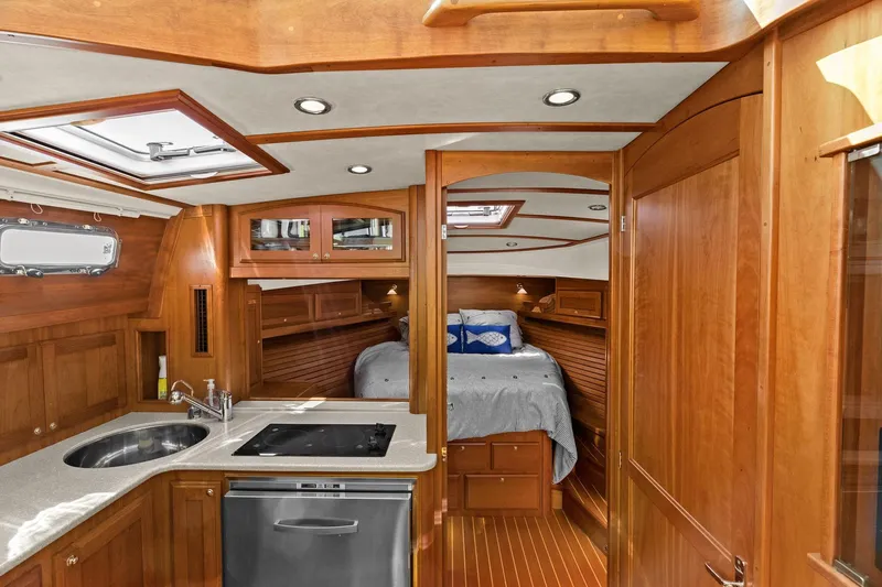 Five O'clock Yacht Photos Pics 2013 Sabre 38 Salon Express interior with wood finish, kitchenette, and cozy bedroom.