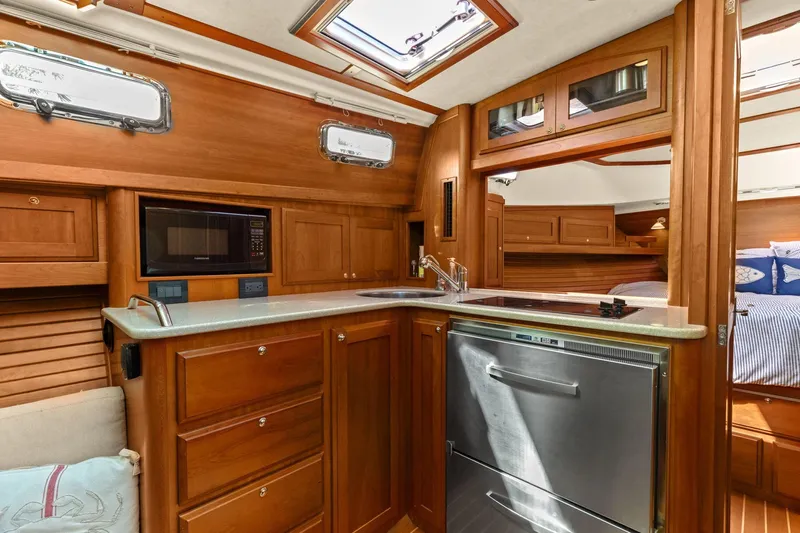 Five O'clock Yacht Photos Pics Luxurious 2013 Sabre 38 Salon Express yacht interior with modern kitchen amenities.
