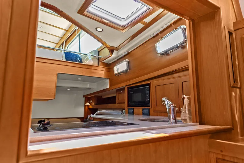 Five O'clock Yacht Photos Pics Interior of 2013 Sabre 38 Salon Express yacht, featuring a modern kitchen area.