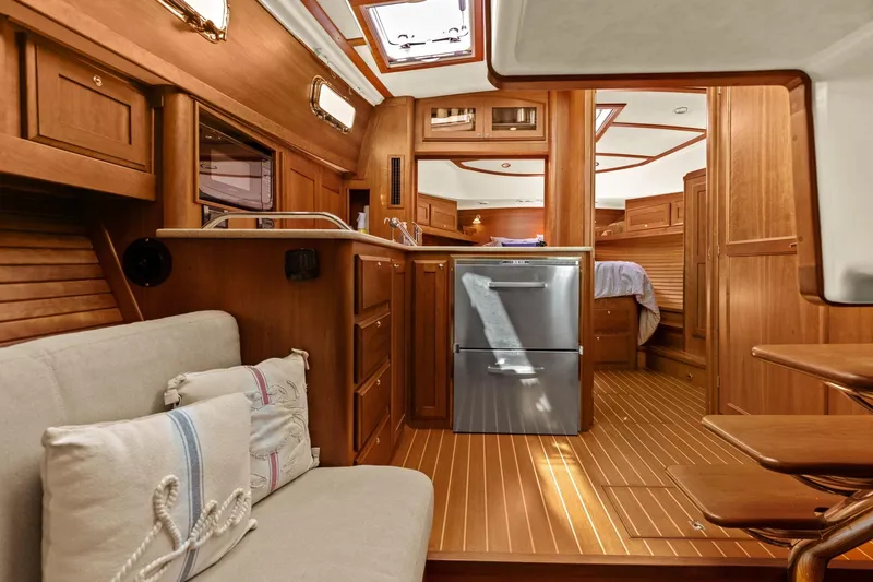 Five O'clock Yacht Photos Pics Luxurious interior of 2013 Sabre 38 Salon Express yacht with wooden finishes.