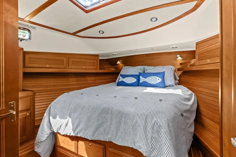 Five O'clock Yacht Photos Pics Cozy cabin interior of 2013 Sabre 38 Salon Express with wood paneling and nautical decor.