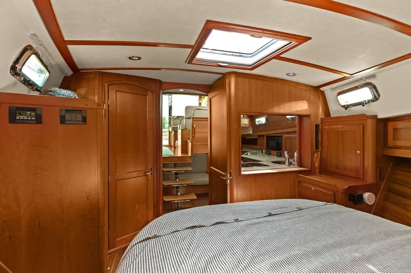 Five O'clock Yacht Photos Pics Interior of 2013 Sabre 38 Salon Express yacht with wood finish and cozy cabin.