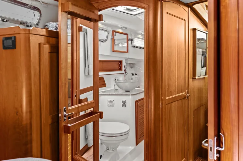 Five O'clock Yacht Photos Pics Interior of 2013 Sabre 38 Salon Express yacht bathroom with wooden cabinetry.