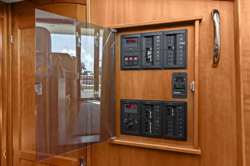 Five O'clock Yacht Photos Pics Electrical panel inside 2013 Sabre 38 Salon Express yacht, featuring control switches and meters.