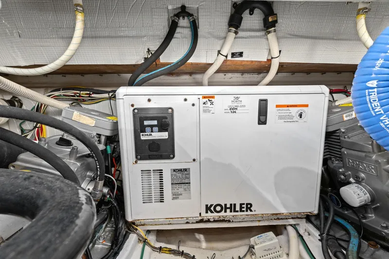 Five O'clock Yacht Photos Pics Engine room of 2013 Sabre 38 Salon Express with Kohler generator.