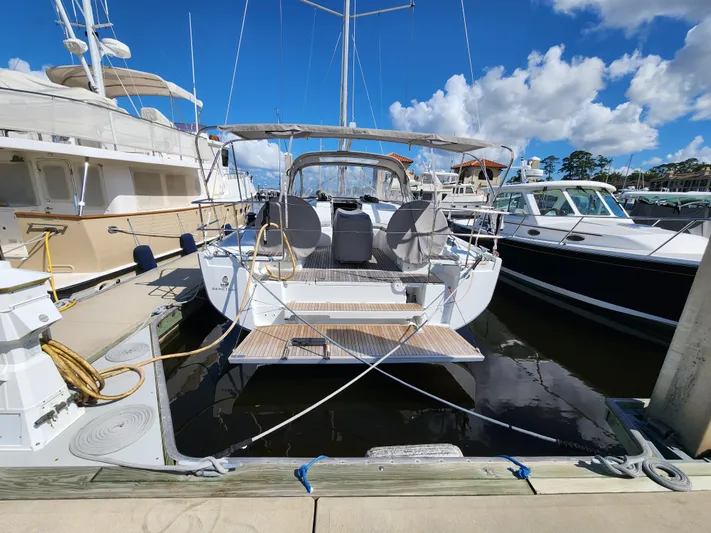 Just A Sign Yacht Photos Pics 2022 Beneteau Oceanis 40.1 yacht docked at marina under blue sky.